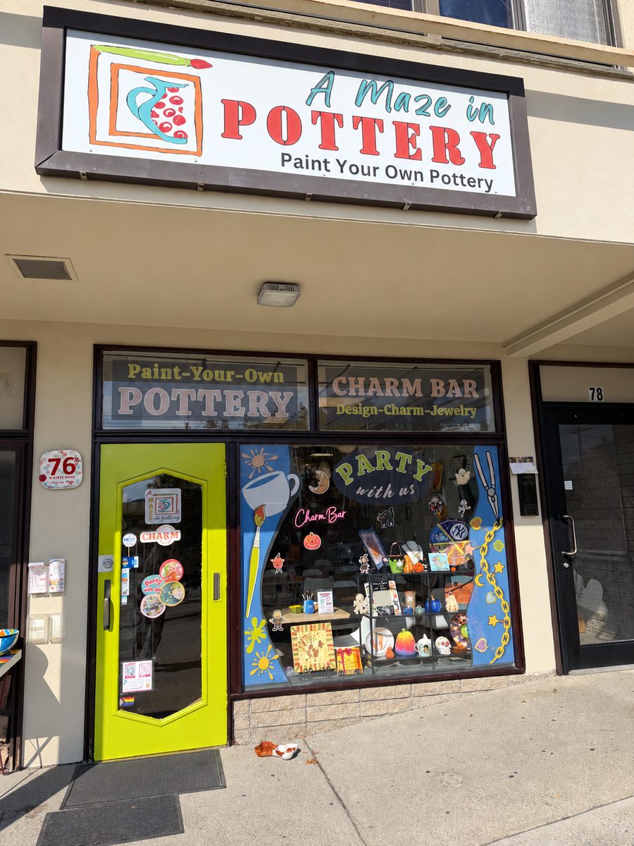 The A Maze in Pottery storefront at 76 North State Rd: Paint Your Own Pottery sign, Charm Bar window and a lime-green door