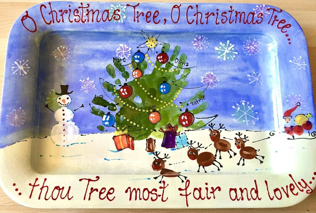 Rectangular Christmas platter with a handprint tree, fingerprint reindeer, snowman and O Christmas Tree lyrics