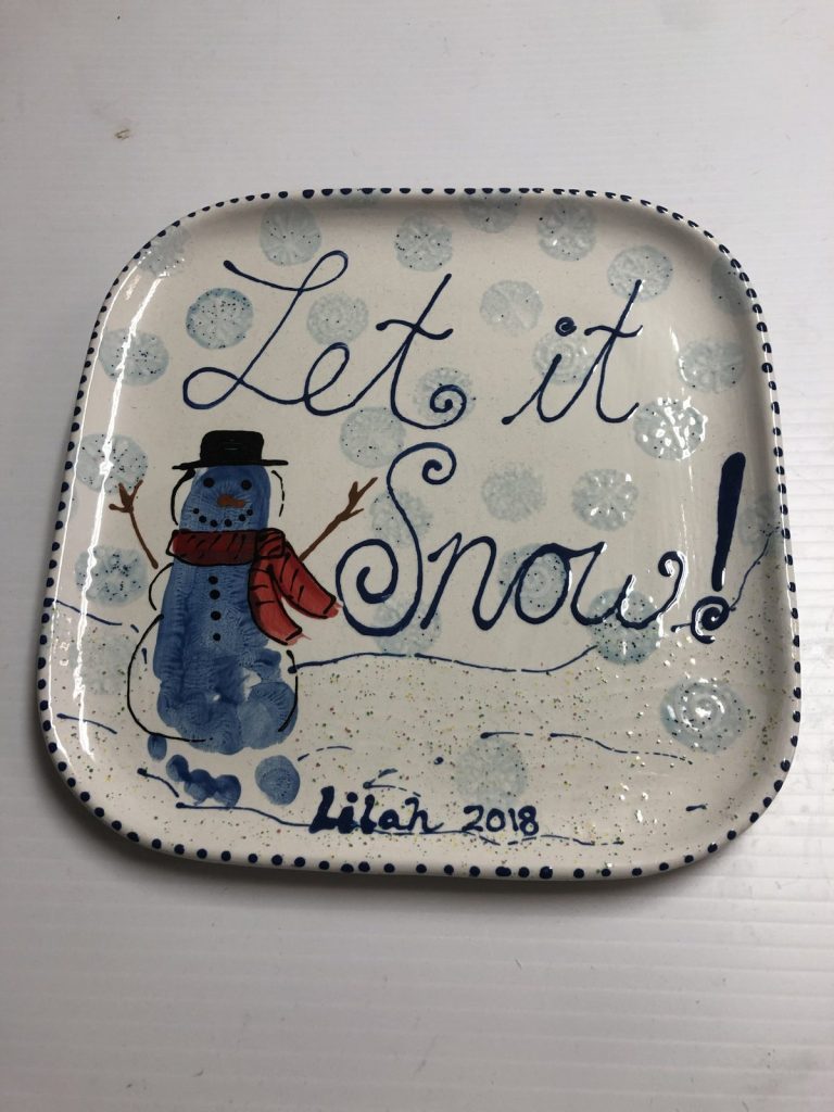Hand-painted square Let it Snow plate with a blue fingerprint snowman and snowflakes, dated 2018