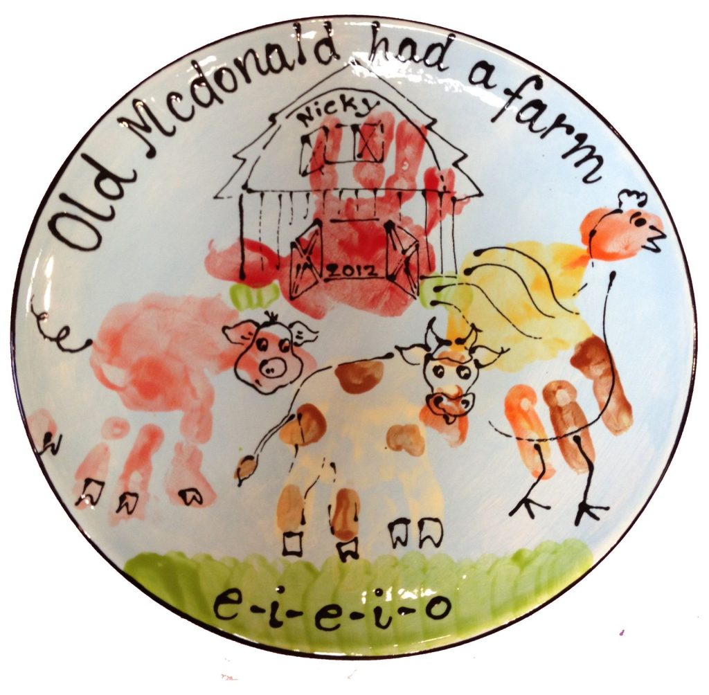 Old McDonald farm plate with handprint barn, pig, cow and chicken in bright colors