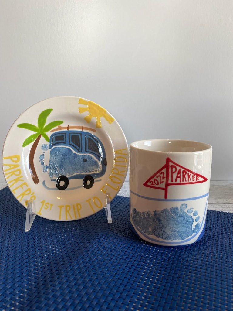 Hand-painted first trip to Florida plate and mug with footprint camper vans and a palm tree
