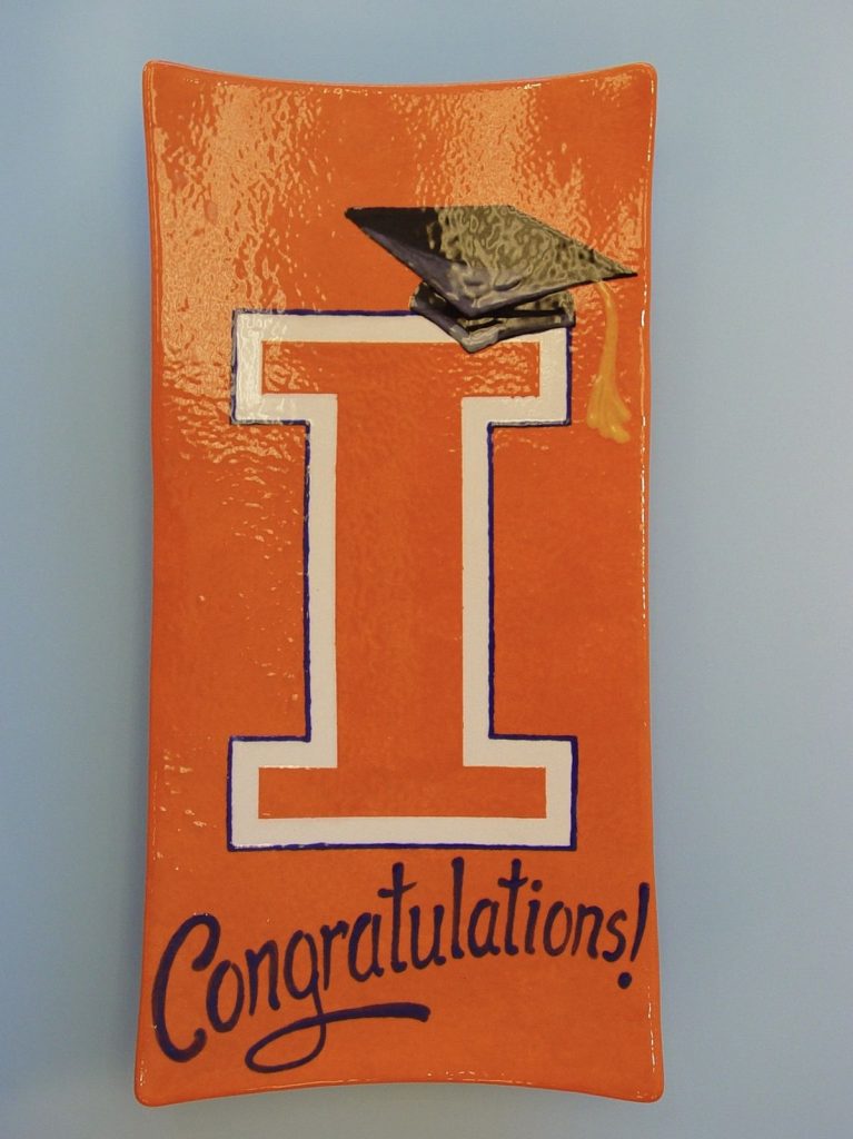 Orange graduation platter with a block I, mortarboard and Congratulations lettering