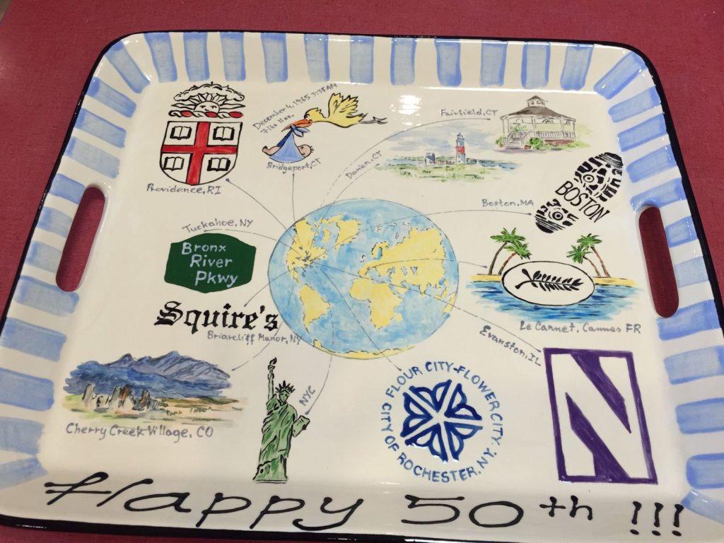 Handled tray for a 50th anniversary mapping a couple's life with a globe, landmarks and crests