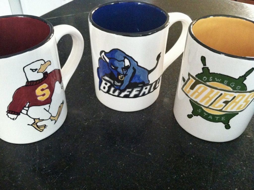 Three hand-painted college mugs with team mascots, a graduation gift set