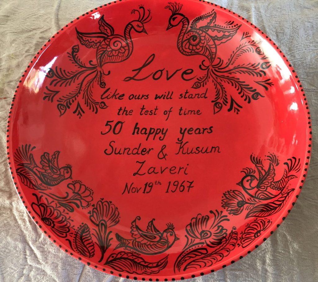 Hand-painted red 50th anniversary plate with black henna-style birds and a love poem, dated 1967