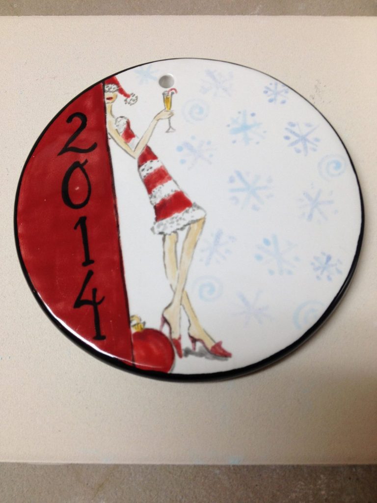Hand-painted round 2014 plate with a woman in a red and white Santa dress and blue snowflakes