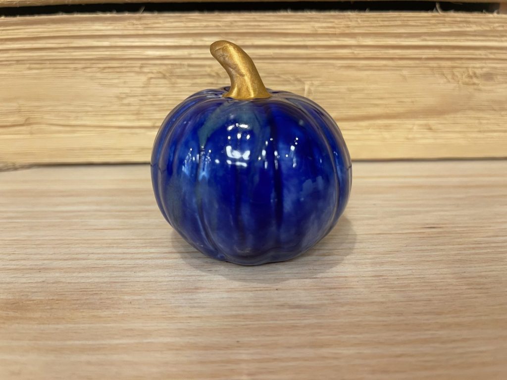 Hand-painted small glossy cobalt blue pumpkin with a gold stem