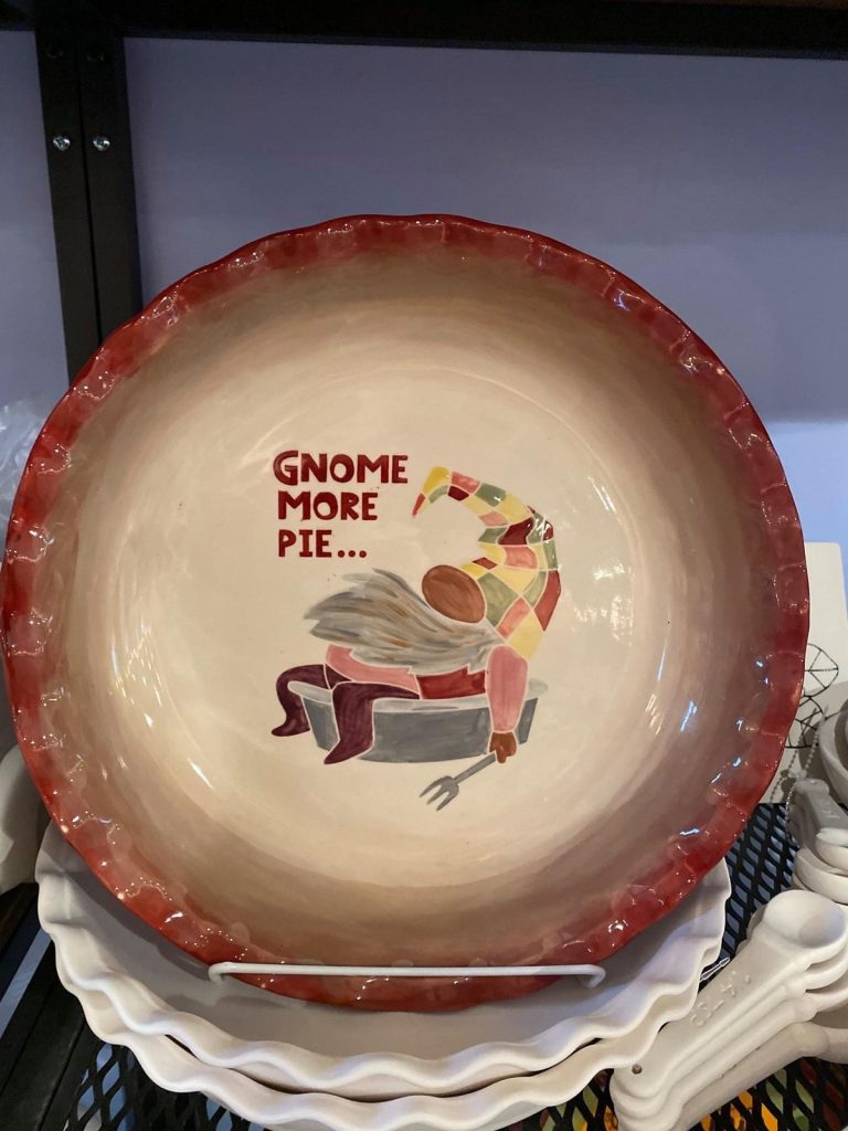 Hand-painted pie dish reading Gnome More Pie with a gnome figure in the center