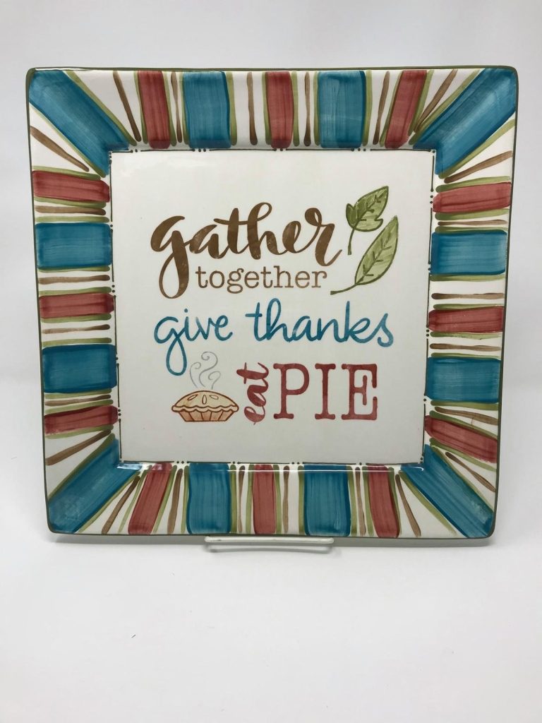 Hand-painted square plate reading gather together, give thanks, and eat PIE with a striped rim