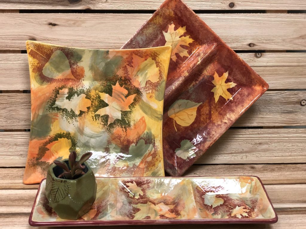 Hand-painted square, rectangular, and divided platters with autumn leaves in orange and rust