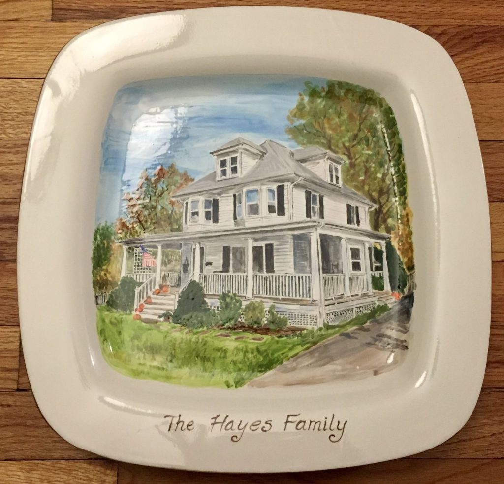 Hand-painted square platter of a white wraparound-porch house with autumn trees and pumpkins on the steps