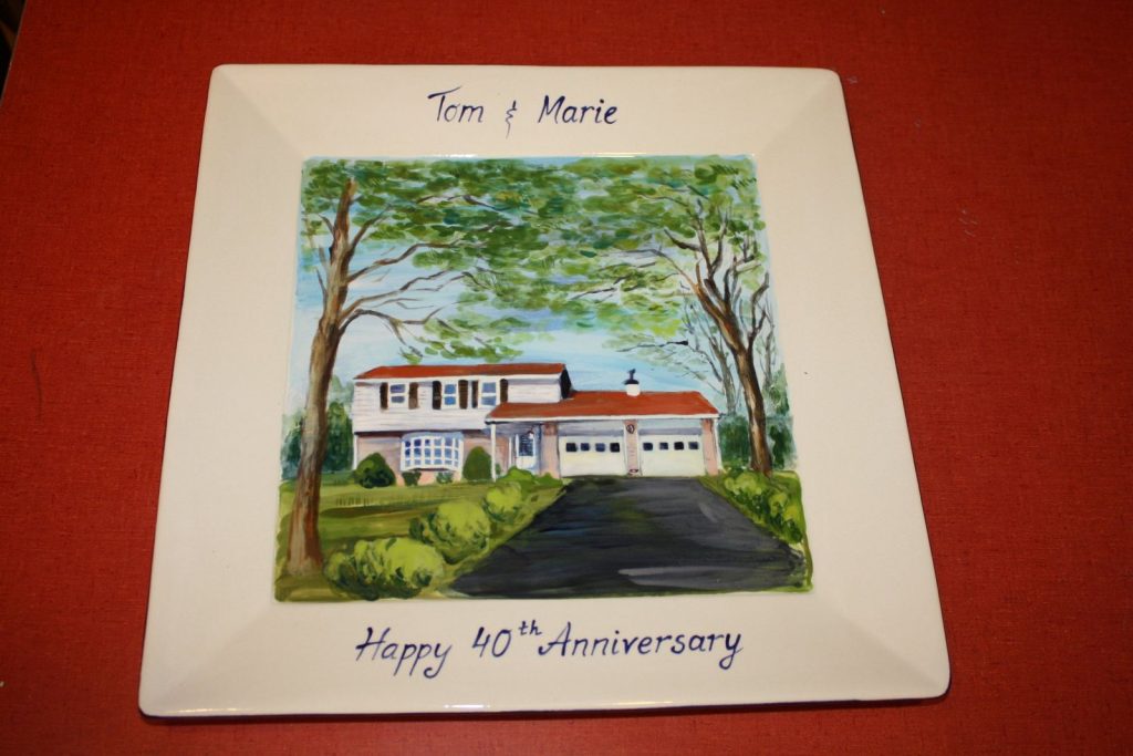 Hand-painted square anniversary platter of a split-level house with a driveway and tall shade trees