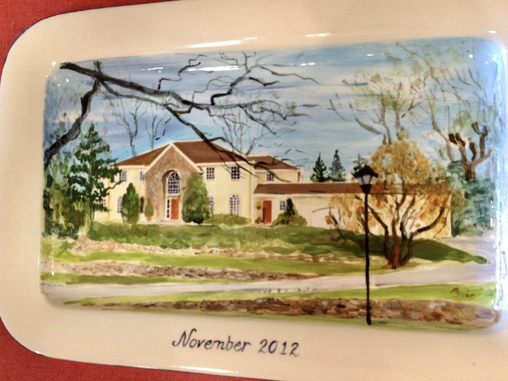 Hand-painted rectangular platter of a stucco house with a lamppost and bare branches, dated November 2012