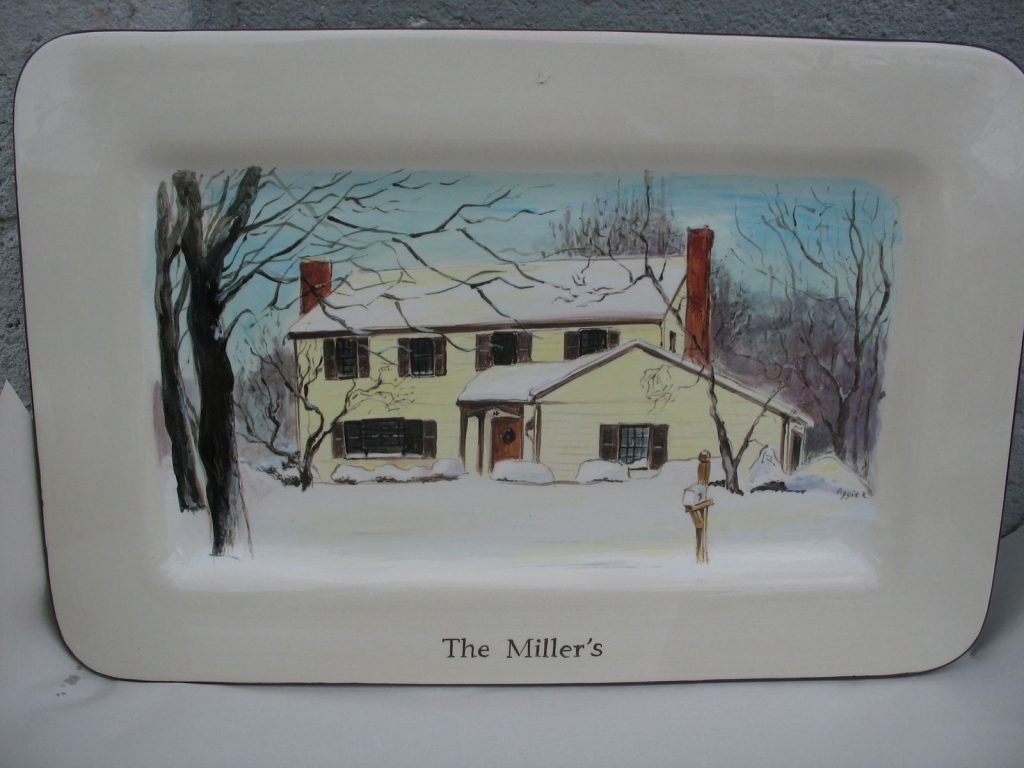 Hand-painted rectangular platter of a pale yellow house in a snowy winter scene with bare trees