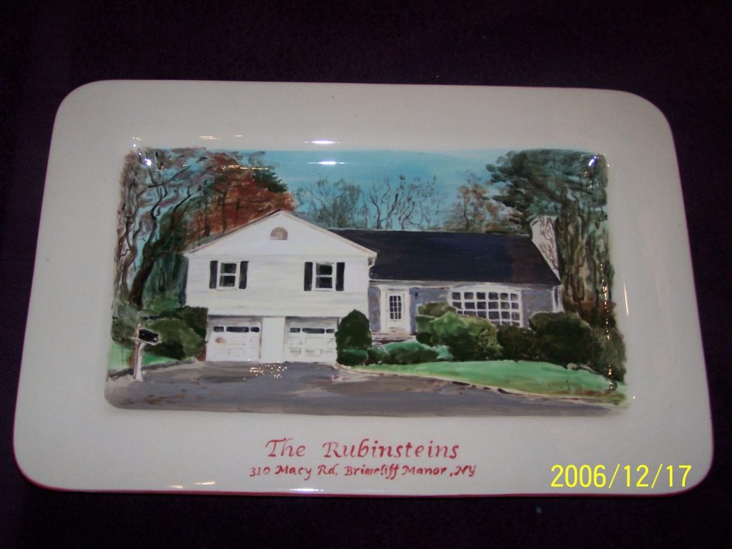 Hand-painted rectangular platter of a white split-level house with fall foliage and a green lawn