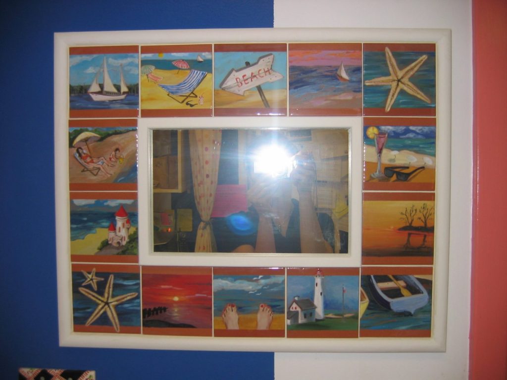 Hand-painted beach-themed tile frame with sailboats, starfish and sunsets around a mirror