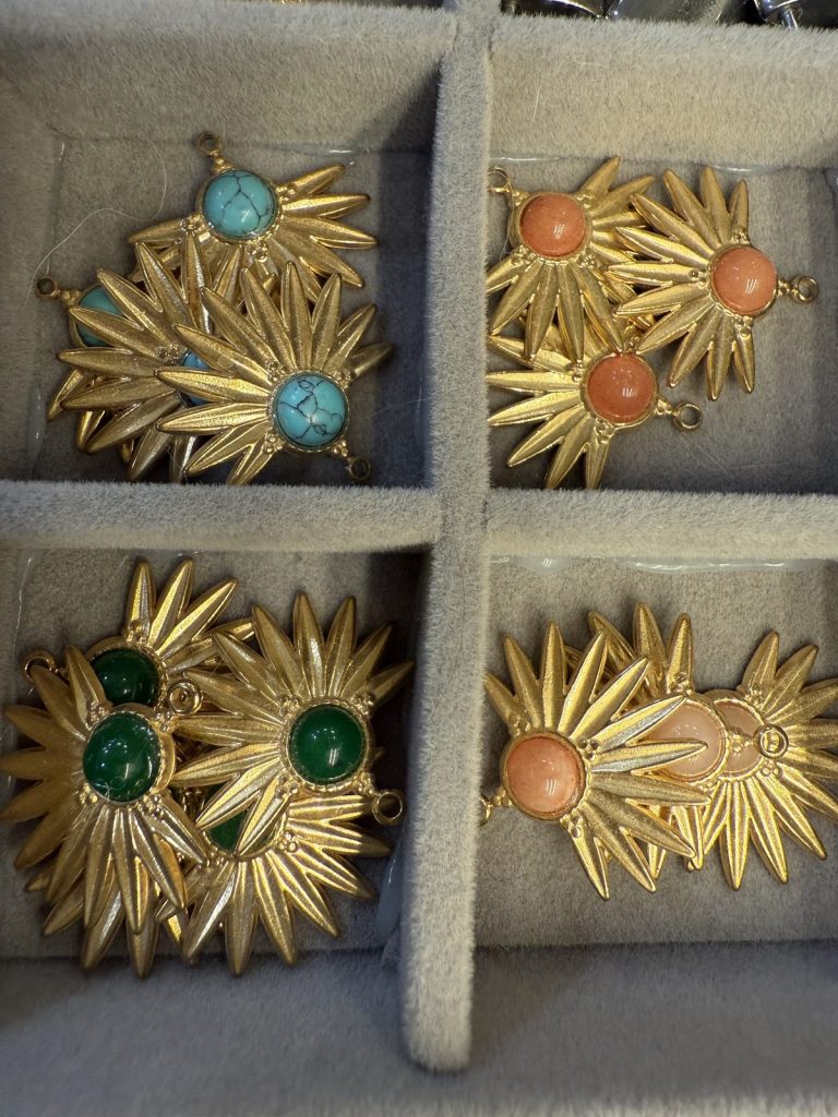 Sunburst charms with turquoise, coral and green stones