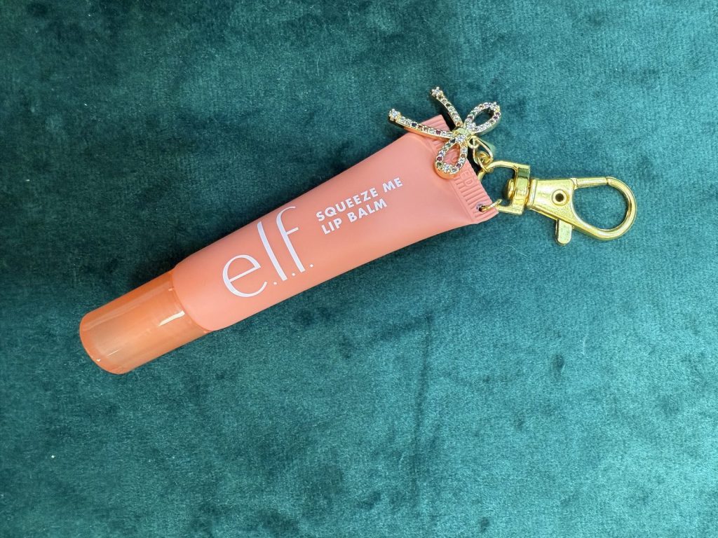 Lip balm holder keychain with a bow charm