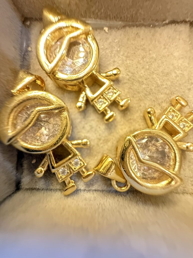 Gold charms with crystal faces