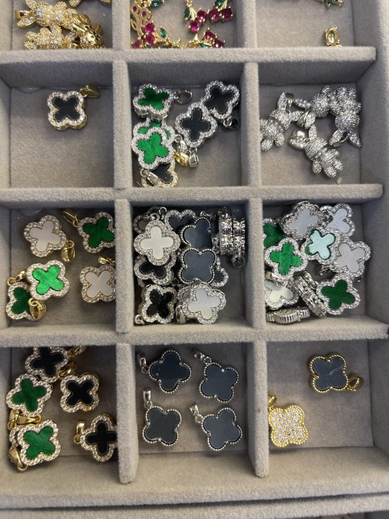 Clover charms in green, black and white