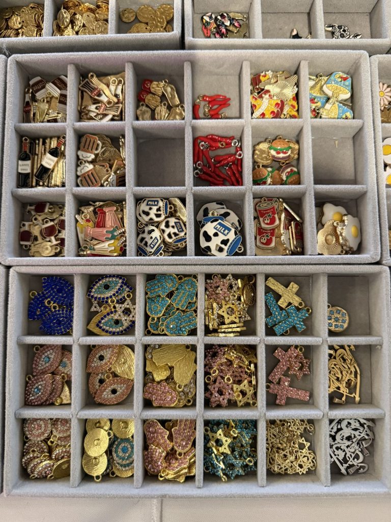 Charm trays with crosses, evil eyes and enamel charms