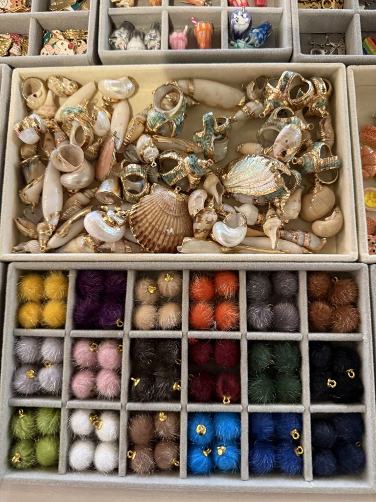 Seashell charms and colorful pom-pom charms