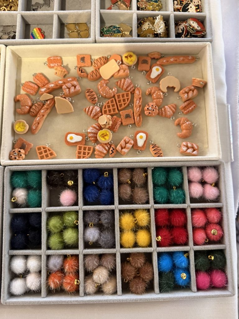 Food charms and a rainbow of pom-pom charms