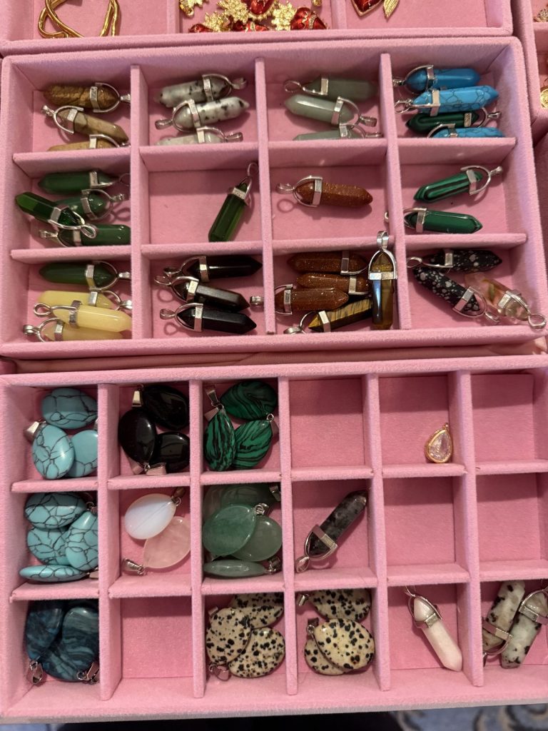 Gemstone point pendants in pink trays