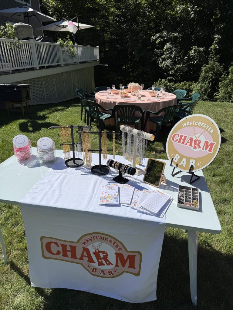 Mobile Charm Bar table set up outdoors for a backyard party