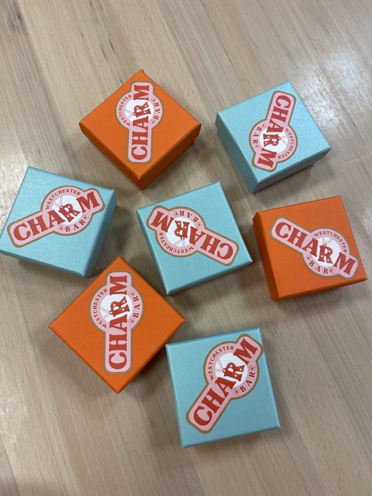 Westchester Charm Bar gift boxes in orange and turquoise