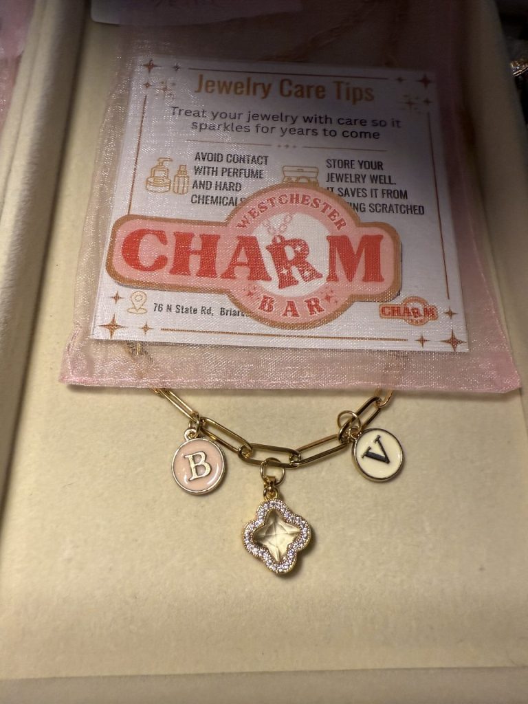 Charm bracelet with initials B and V and a crystal clover