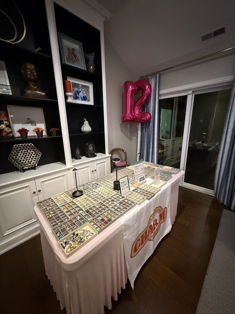 Guests leaning over the trays to pick charms