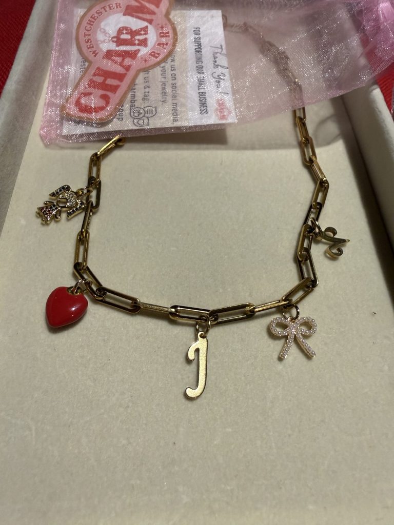 Paperclip bracelet with a red heart, an initial J and a bow