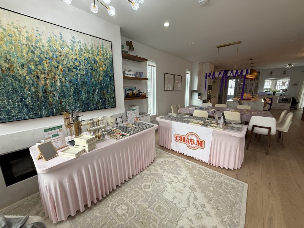 Mobile Charm Bar tables in front of a stone fireplace decorated with flowers