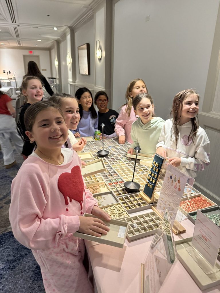Smiling kids at a Charm Bar birthday party