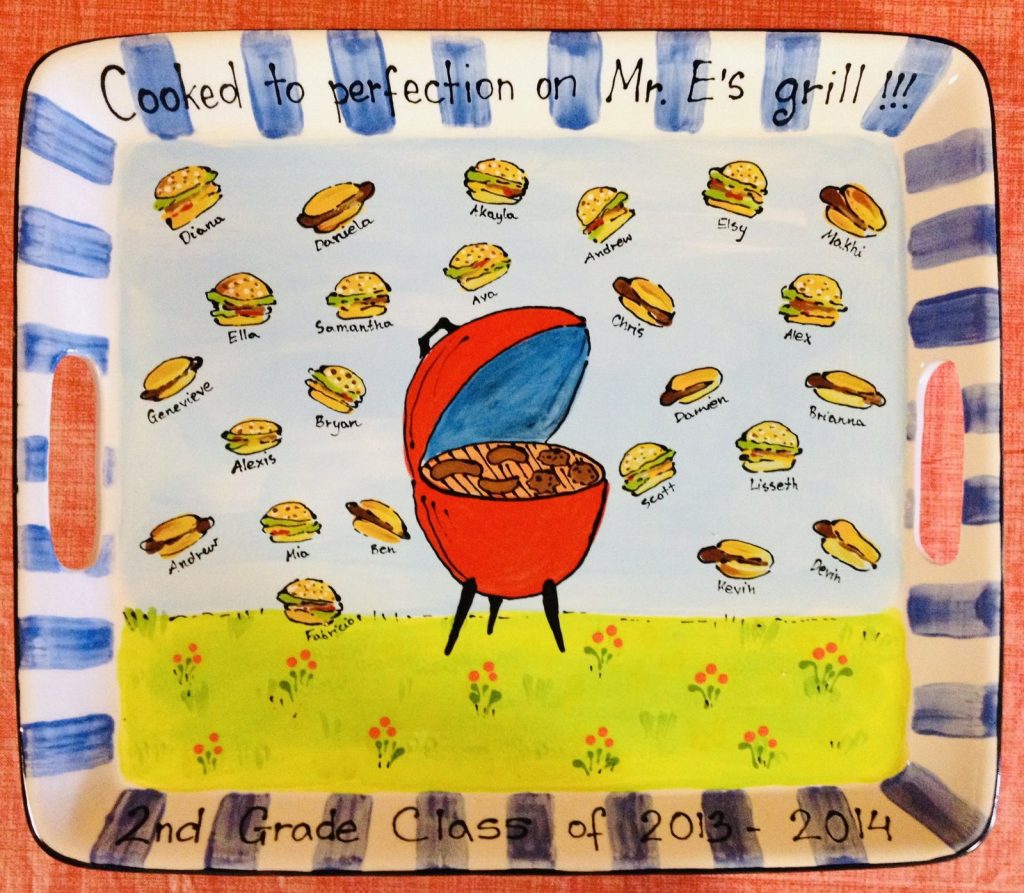 Rectangular class platter with a red grill and fingerprint burgers and hot dogs labeled with student names