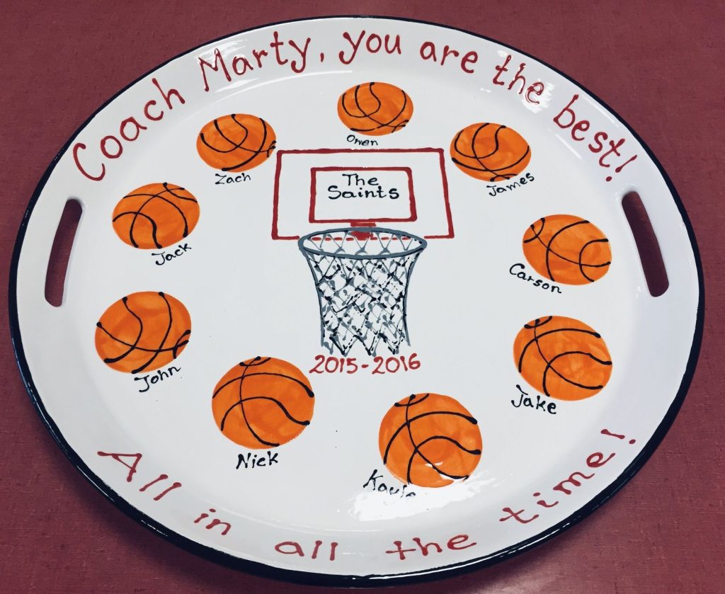 Round coaching gift platter with fingerprint basketballs around a hoop, each labeled with a player's name