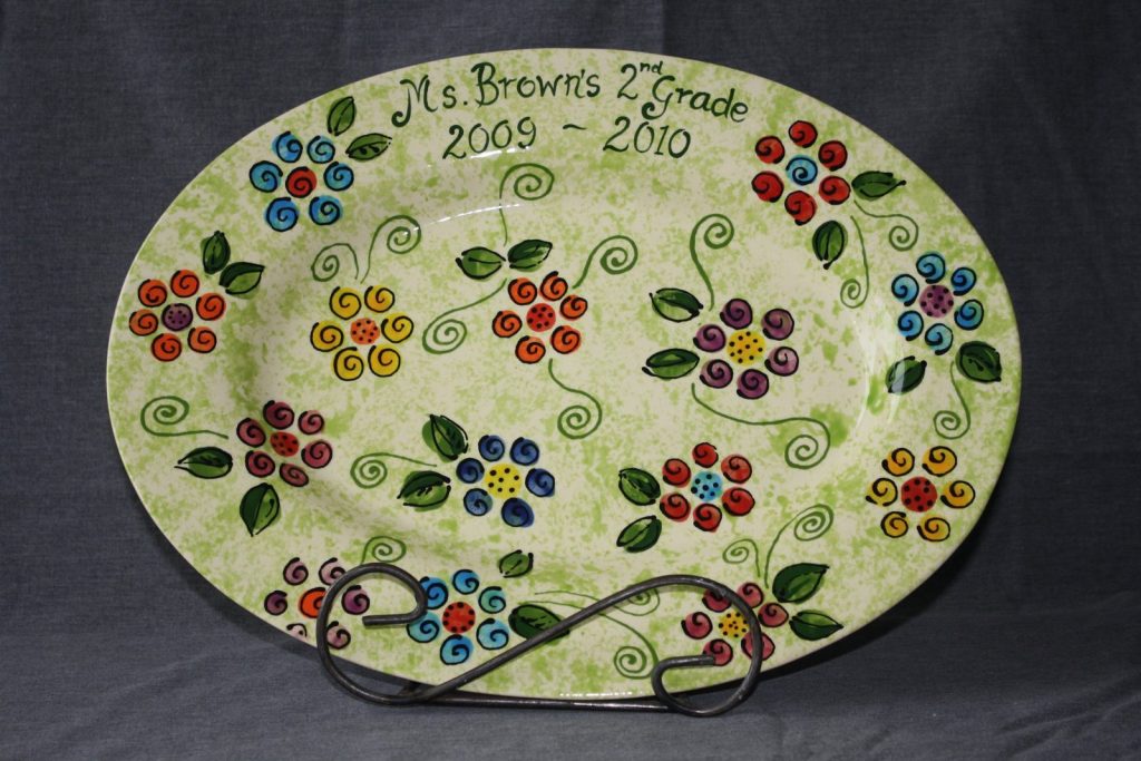 Hand-painted oval class platter of colorful fingerprint flowers on speckled green for a 2nd grade class, 2009–2010