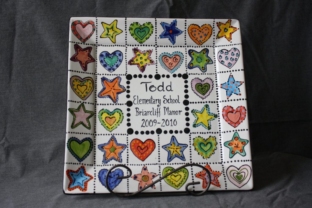 Hand-painted square class platter of colorful heart and star tiles around a Todd Elementary School 2009–2010 center