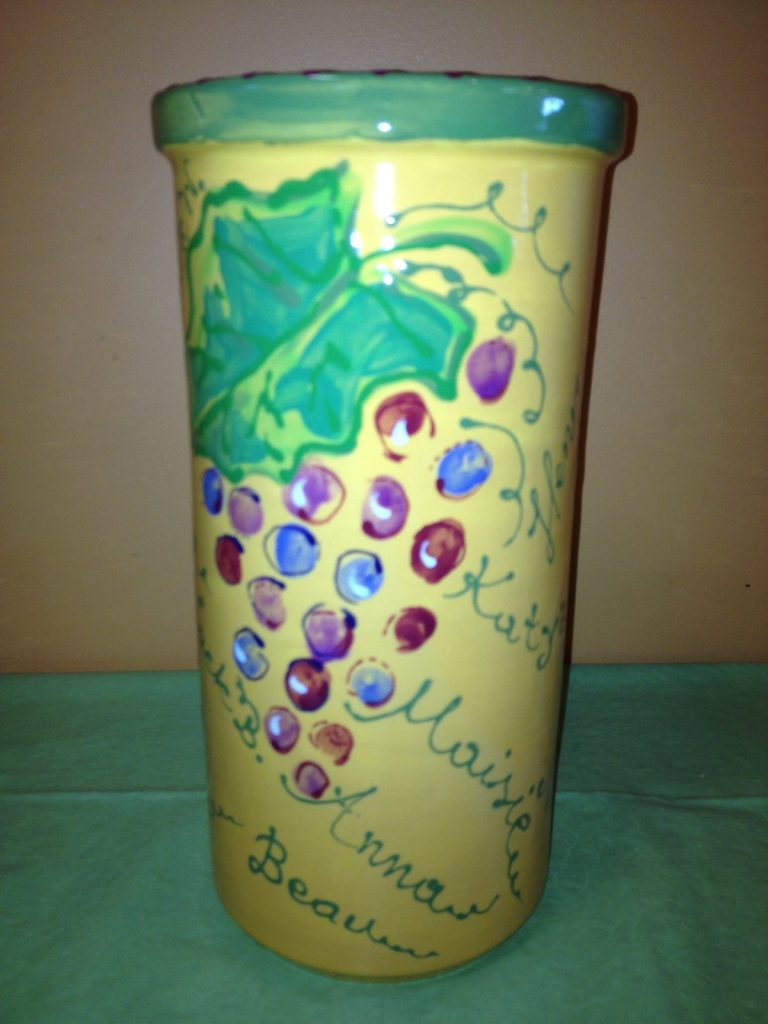 Hand-painted tall cream vase with fingerprint grape clusters, a green leaf and children's names