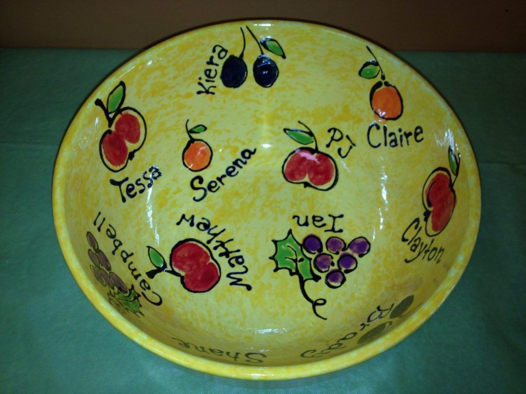 Hand-painted yellow bowl of fingerprint apples, cherries and grapes with children's names
