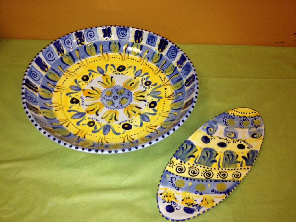 Hand-painted blue and yellow Tuscan-style bowl with a matching oval spoon rest and children's names