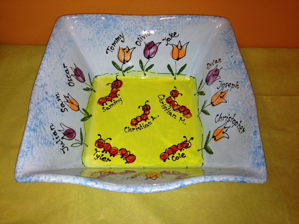 Hand-painted square bowl with fingerprint tulips and red fingerprint ants on a yellow center with names