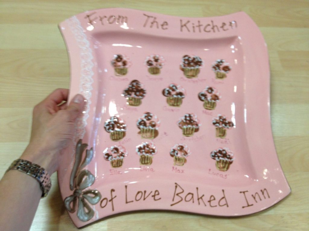 Hand-painted pink wavy platter of fingerprint cupcakes, "From The Kitchen of Love Baked Inn"