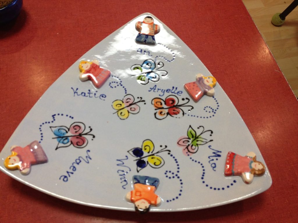Hand-painted triangular platter with fingerprint butterflies, small sculpted children and names