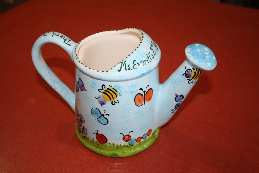 Hand-painted sky blue watering can with fingerprint bees, butterflies and ladybugs