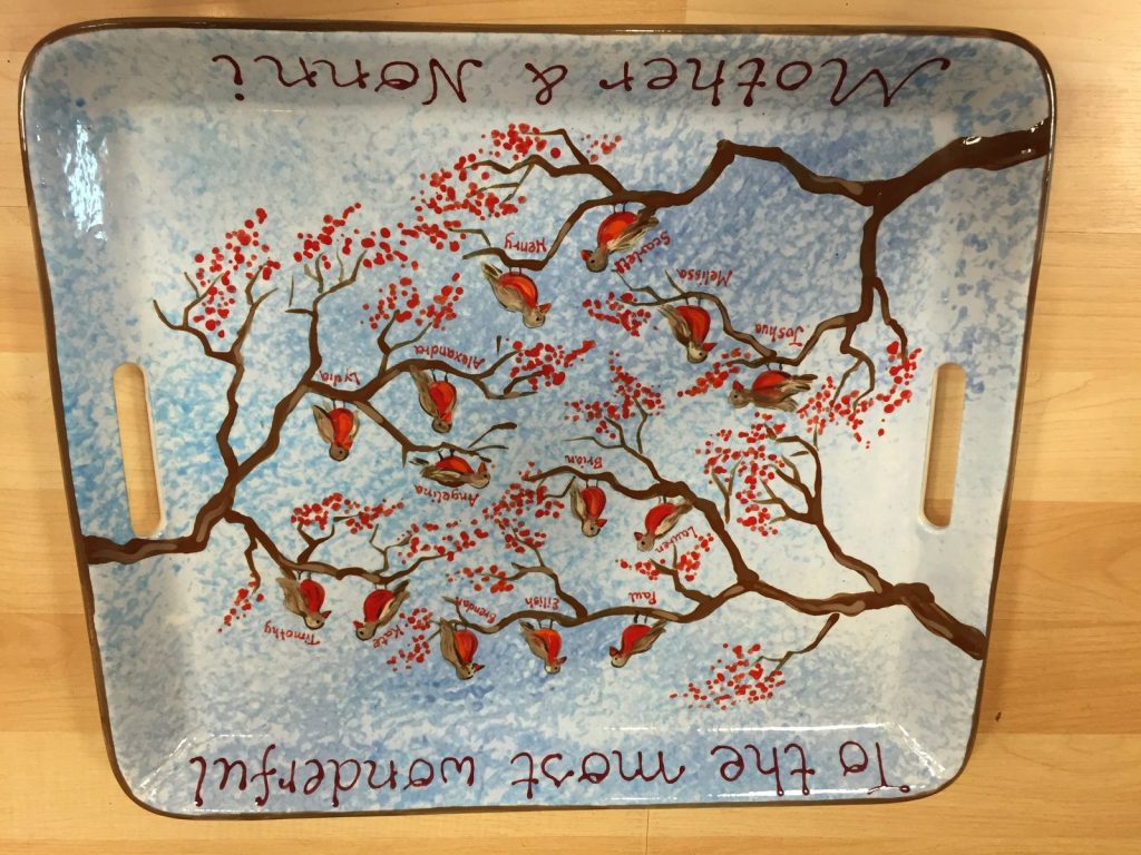 Hand-painted handled tray of a branch with red fingerprint blossoms on speckled blue