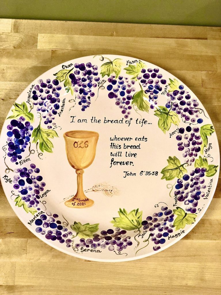 Hand-painted round communion plate with fingerprint grapes, a gold chalice and "I am the bread of life" verse