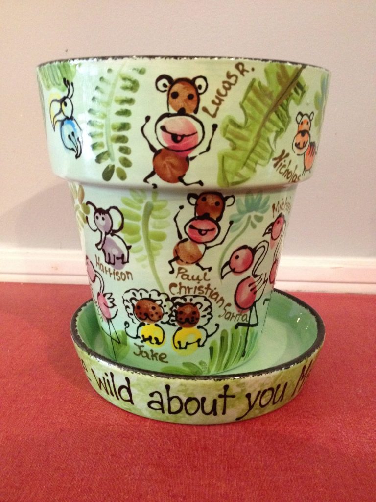 Hand-painted flowerpot and saucer with fingerprint monkeys and lions, "wild about you"