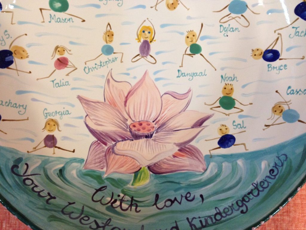 Hand-painted kindergarten platter with a pink lotus on water and fingerprint yoga figures, "With love"